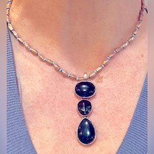 Lovely blue 3-stone pendant on brushed gold chain